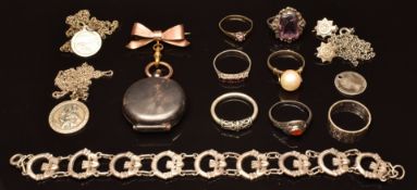 A collection of silver jewellery including six silver rings, St Christopher, bracelet with