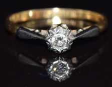 An 18ct gold ring set with a diamond in a platinum setting, size L/M, 2g