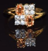 A 9k gold ring set with orange and white sapphires, size M, 4.3g