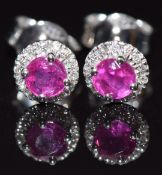 A pair of 18ct white gold earrings set with natural unheated Burmese rubies (total 0.55cts)