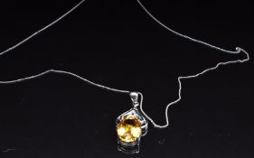 A 9k white gold pendant set with citrine and white topaz on 9k white gold chain, 4.1g