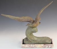 Bronze sculpture of an albatross flying over a cresting wave, on marble base, with impressed Rene