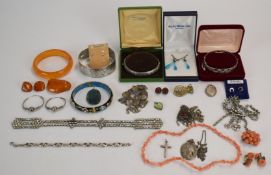 Two silver bangles, amber jewellery, coral brooch, coral earrings, necklaces, silver earrings, etc