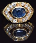 An 18ct gold ring set with an oval cut sapphire of approximately 1.2ct and diamonds, size M, 5.1g