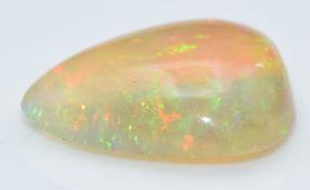A loose pear shaped opal cabochon measuring approximately 2.34cts