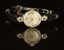 Marvin platinum diamond set ladies wristwatch with silver hands, hour markers and dial, on black