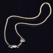 A 9ct gold anklet with heart charm, 2.8g