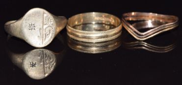 A 9ct gold signet ring set with a diamond, and two other 9ct gold rings, 3.7g