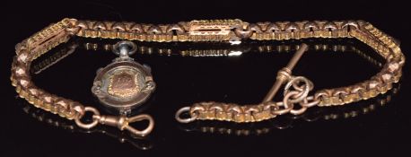 Victorian 9ct gold Albert chain made up of faceted and engraved links, 27.5g, with a silver fob