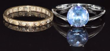 A 9ct white gold ring set with topaz and a yellow metal eternity ring, size P, 4g