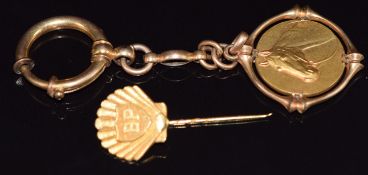 A 9ct gold BP pin (3.4g) and a rolled gold horse pendant/ fob