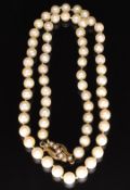 A single strand of pearls with 9ct gold clasp set with seed pearls