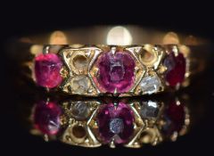 Edwardian 18ct gold ring set with rubies and diamond, in antique box, size J, 2.3g