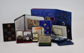 A collection of coin packs and cased examples including a George III cartwheel pair