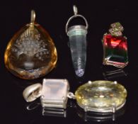 Four silver pendants set with carved paste, quartz, fluorite, etc