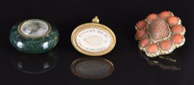 A moss agate compass charm, carved coral Victorian brooch and a yellow metal intaglio seal set