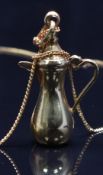 An 18ct gold necklace/ chain and an 18ct gold pendant/ charm in the form of a jug, 4.1g