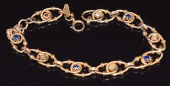 Edwardian 9ct gold bracelet made up of overlapped oval links set with sapphires and diamonds, 8.6g