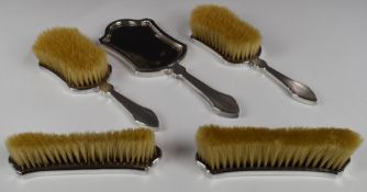 George V hallmarked silver dressing table set comprising hand mirror and two pairs of brushes,