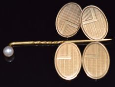 A pair of Art Deco 9ct gold cufflinks, Birmingham 1934, 9.5g and a yellow metal stick pin set with a