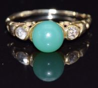 A 19thC yellow metal ring set with two diamonds and a bead, size J, 1.9g