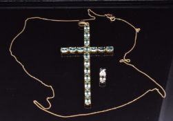 A 9k gold cross pendant set with oval apatite and a 18k white gold pendant set with Zultanite and