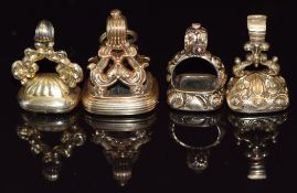 Four Victorian intaglio seals/ fobs set with agate, one carved as a phoenix, one reading 'Friend'