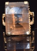 A 9ct gold ring set with a rectangular mixed cut smoky quartz, size L, 8.8g
