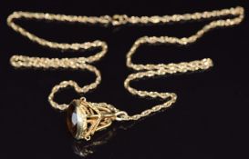 A 9ct gold fob set with smoky quartz on a 9ct gold chain/ necklace, 13.4g