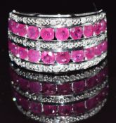 A 9ct white gold ring set with rubies and diamonds, size M, 6.4g
