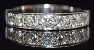 An 18ct white gold half eternity ring set with seven round cut diamonds, of approximately 0.15ct,