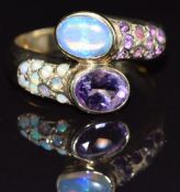 A 9ct gold ring set with amethysts and opals, size O, 4.3g
