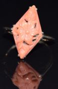 A 9ct gold ring set with carved coral, size M, 2.9g