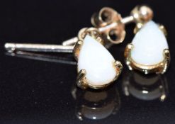 A pair of 9ct gold earrings set with pear cut opals, 1g