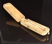 Edwardian 9ct gold stick pin set with an amethyst and seed pearls in Dublin box, 1g