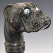 A vintage walking stick with bronze bulldog head handle