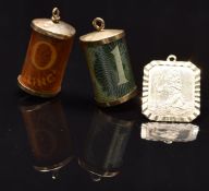Two 9ct gold charms set with a 1 pound and 10 shilling note and a 9ct gold St Christopher, 7g