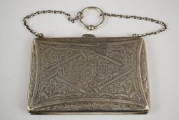 George V hallmarked silver ladies evening purse with fitted interior, suspended on a chain,