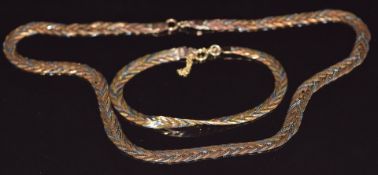 A 9ct gold plaited tri-coloured necklace and bracelet, 14.9g