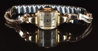 Milus 18ct gold ladies wristwatch with gold hand and hour markers, silver dial and signed