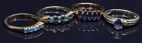 Four 9ct gold rings set with tanzanites and diamonds, etc, size N, 8.9g