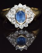 A 9ct gold ring set with an oval sapphire and diamonds, size M, 3.8g