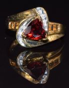 A 9k gold ring set with garnets, citrine and diamonds, size M/N, 2.9g
