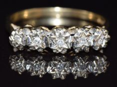 A 9ct gold ring set with five diamonds in star settings, size P, 2.4g