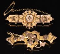 Edwardian 9ct gold brooch in the form of a heart depicting a dove and a 9ct gold brooch set with a