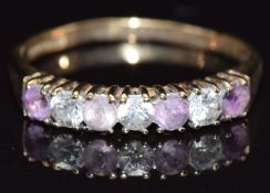 A 9ct gold ring set with amethysts and cubic zirconia, size O, 1.6g