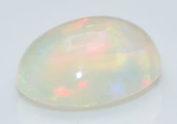 A loose oval opal cabochon measuring approximately 1.34cts