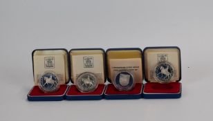 Four silver crown sized coins comprising three 1977 Queen Elizabeth Silver Jubilee examples and a