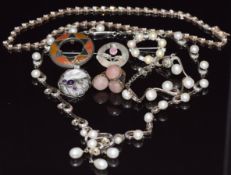 A silver agate brooch, Birmingham 1908, silver thistle brooch, silver necklace and bracelet set with