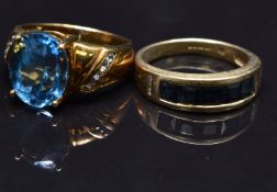 Two 9ct gold rings set with topaz and sapphires, size M, 8.8g